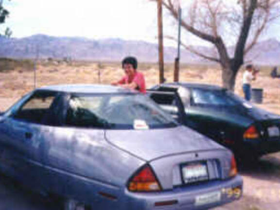 Lisa driving her EV1 to Las Vegas with a group of EV1 drivers